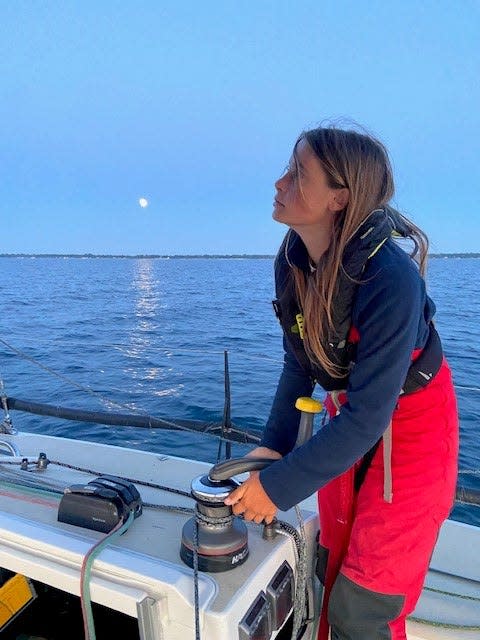 Merritt Sellers, 14, of Larkspur, California grinds the winch while trimming the spinnaker sail on the family's  J/111 sailboat early July 14, 2022 on Lake Huron while delivering "nosurprise" from Harbor Springs to Port Huron for the Bayview Mackinac Race on Saturday, July 16, 2022.