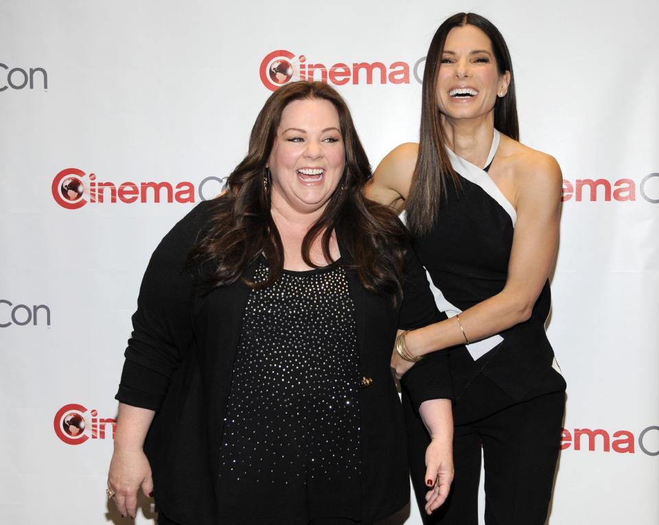 Melissa McCarthy, left, and Sandra Bullock, cast members in the upcoming film "The Heat," pose together before 20th Century Fox's presentation at CinemaCon 2013 at Caesars Palace on Thursday, April 18, 2013 in Las Vegas. (Photo by Chris Pizzello/Invision/AP)