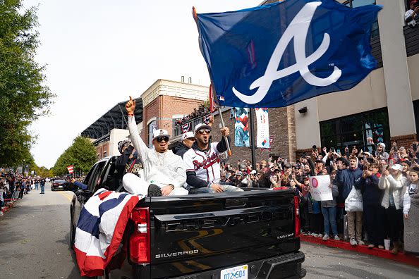 ATLANTA, GA - NOVEMBER 05: Members of the Atlanta Braves cheer during the World Series Parade at Truist Park on November 5, 2021 in Atlanta, Georgia. The Atlanta Braves won the World Series in six games against the Houston Astros winning their first championship since 1995. (Photo by Megan Varner/Getty Images)