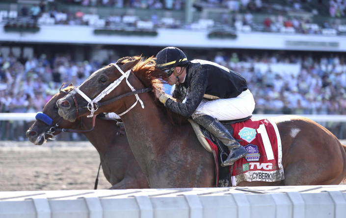 In a photo provided by Equi-Photo, Cyberknife (1), with Florent Geroux riding, wins the $1 million Haskell Stakes horse race at Monmouth Park in Oceanport, N.J., Saturday, July 23, 2022. Taiba, outside, finished second. (Ryan Denver/Equi-Photo via AP)