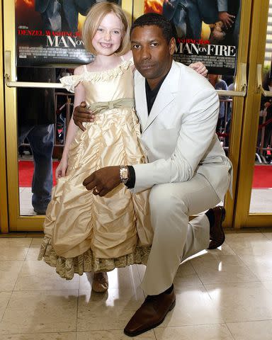 E Charbonneau/Bei/Shutterstock Dakota Fanning and Denzel Washington in April 2004