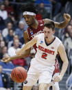 Belmont's Grayson Murphy (2) and Temple's Quinton Rose, left, scramble for the ball during the first half of a First Four game of the NCAA college basketball tournament, Tuesday, March 19, 2019, in Dayton, Ohio. (AP Photo/John Minchillo)