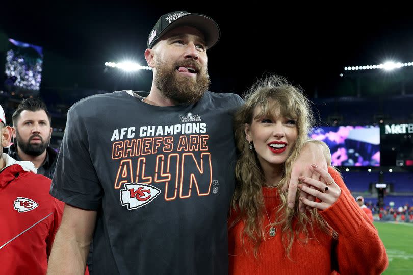 Travis Kelce #87 of the Kansas City Chiefs celebrates with Taylor Swift after a 17-10 victory