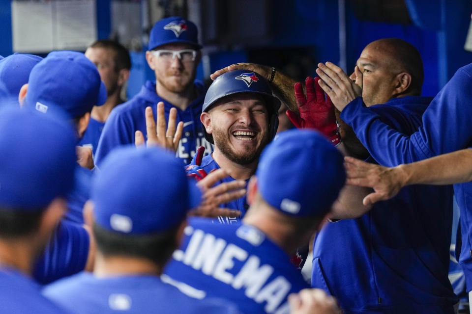 Toronto Blue Jays' Alejandro Kirk (30) celebrates his home run against the Houston Astros with teammates in the dugout in the second inning of a baseball game, in Toronto, Monday, June 5, 2023. (Andrew Lahodynskyj/The Canadian Press via AP)