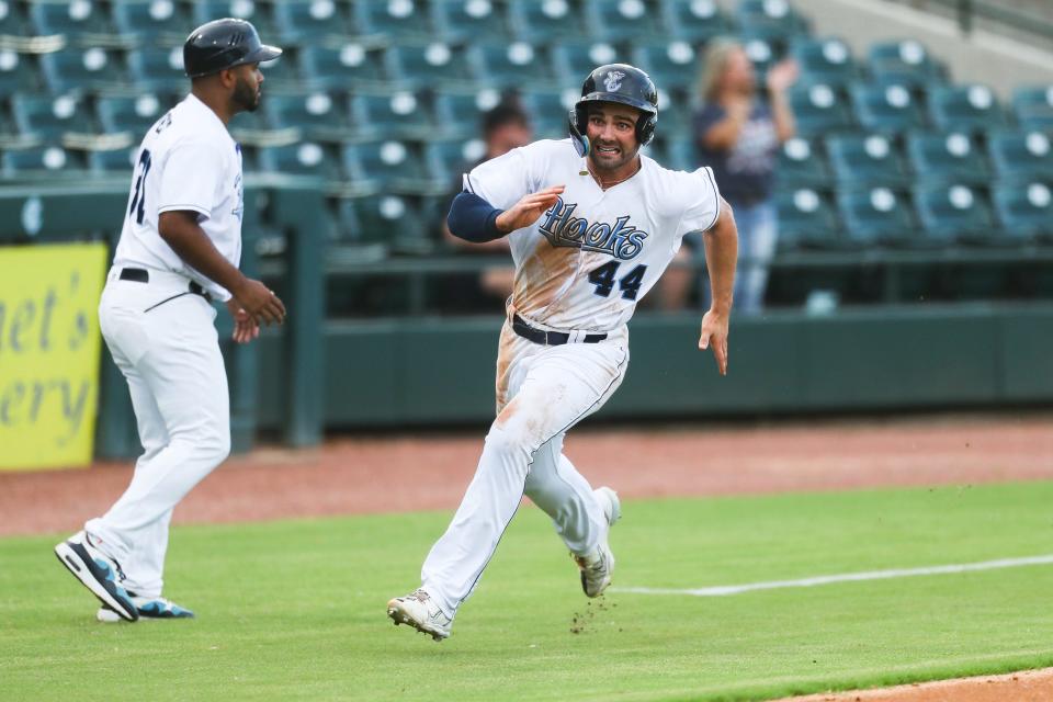 Hooks outfielder Ross Adolph (44) rounds third base before scoring a run in a Double-A baseball game against the Midland RockHounds at Whataburger Field in Corpus Christi, Texas on Wednesday, Sep. 7, 2022.