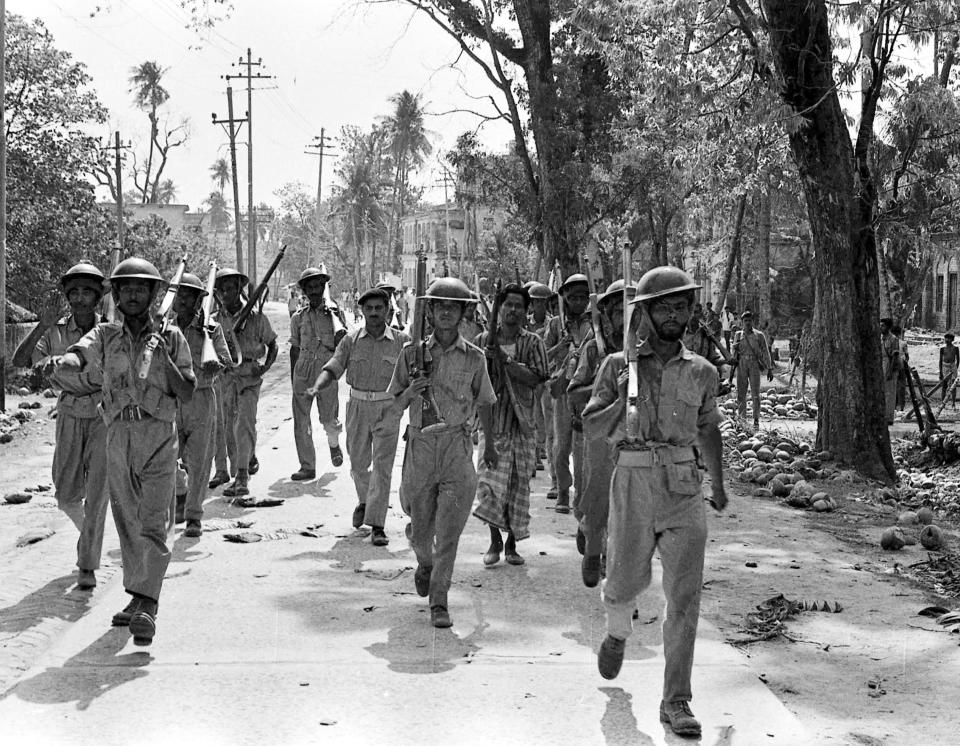 FILE - In this April 2, 1971, file photo, troops of Bangladesh Freedom Army, followers of East Pakistan's Sheikh Mujibur Rahman march off to war against Pakistan Army troops, near Jessore, East Pakistan. Bangladesh is celebrating 50 years of independence this year. (AP Photo, File)