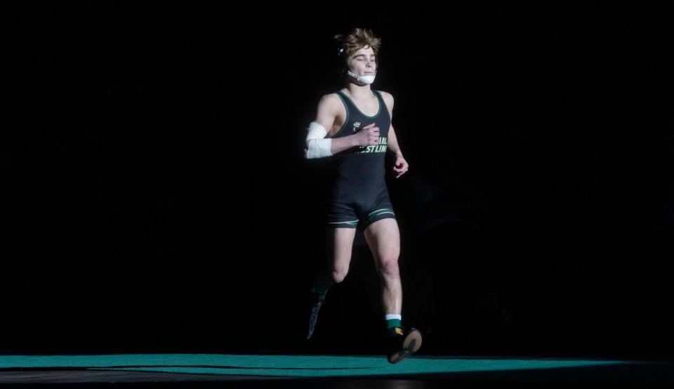 Brick Memorial's Anthony Santaniello, shown running out to the mat before he defeated Mount Olive's Jack Bastarrika 10-0 in the 132-pound NJSIAA championship match, has signed a national letter of intent to Pitt, he announced Thursday morning on instagram