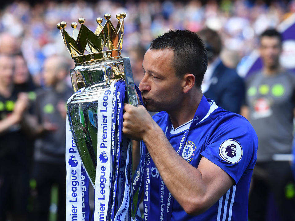 Terry lifted the trophy at the end of the game: Getty