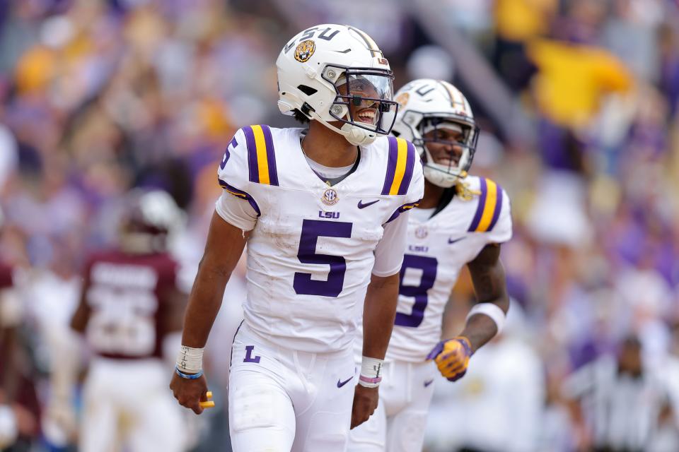 BATON ROUGE, LOUISIANA - NOVEMBER 25: Jayden Daniels #5 of the LSU Tigers celebrates a touchdown during the second half against the Texas A&M Aggies at Tiger Stadium on November 25, 2023 in Baton Rouge, Louisiana. (Photo by Jonathan Bachman/Getty Images)