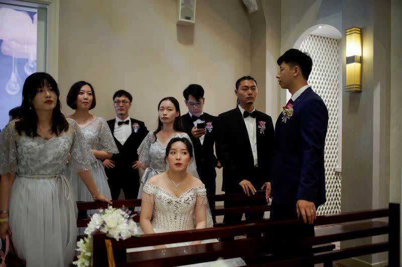 The Wider Image: Coronavirus dampens celebrations in China's wedding gown city