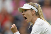 Britain's Katie Boulter celebrates after winning a point against Karolina Pliskova of the Czech Republic in a second round women's singles match on day four of the Wimbledon tennis championships in London, Thursday, June 30, 2022. (AP Photo/Kirsty Wigglesworth)