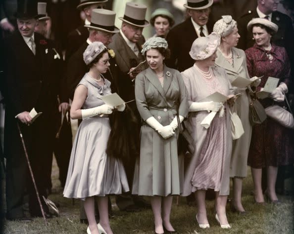<p>Princess Margaret, Queen Elizabeth II, and the Queen Mother visit the Epsom Downs Racecourse for the Derby.</p>