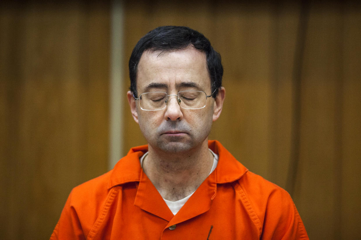 Image: Larry Nassar listens during his sentencing at Eaton County Circuit Court in Charlotte, Mich., on Feb. 5, 2018. (Cory Morse / The Grand Rapids Press via AP file)