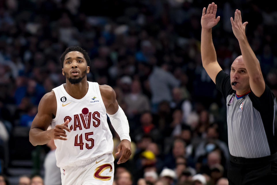 Cleveland Cavaliers guard Donovan Mitchell (45) jogs down the floor after hitting a three point shot in the first half of an NBA basketball game against the Dallas Mavericks in Dallas, Wednesday, Dec. 14, 2022. (AP Photo/Emil Lippe)