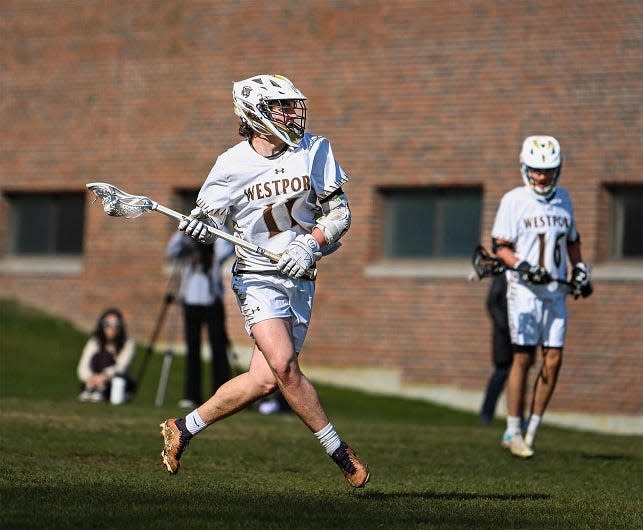 Westport's Will Quinlan heads upfield with the ball during the season opener against Cape Cod Tech at Westport High School on April 1, 2024.