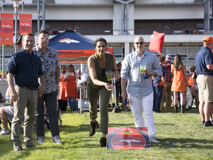 Padma and Tom at Mile High Stadium in Denver