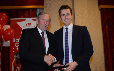 Inter county All Star Cillian O'Connor receives his four medals from the 2014 season from Paddy Prendergast. - Credit: The Mayo News