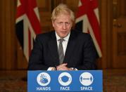 Britain's Prime Minister Boris Johnson speaks during a press conference at 10 Downing Street in London