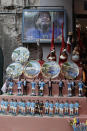 Statuettes of soccer legend and former Napoli player Diego Armando Maradona are displayed together with souvenirs in downtown Naples, Italy, Wednesday, Sept. 18, 2019. “One of the first figurines we made was of Diego Armando Maradona and you can imagine how many we sold. Still today, it sells a lot,” said craftsman Marco Ferrigno, who runs the most prominent shop on the street. (AP Photo/Gregorio Borgia)