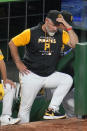 Pittsburgh Pirates manager Derek Shelton stands on the dugout steps during the eighth inning of the team's baseball game against the Milwaukee Brewers in Pittsburgh, Friday, July 1, 2022. The Brewers won 19-2. (AP Photo/Gene J. Puskar)