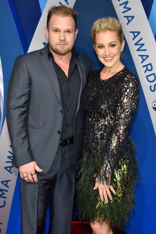 <p>John Shearer/WireImage</p> Kyle Jacobs and Kellie Pickler attend the 51st annual CMA Awards at the Bridgestone Arena on November 8, 2017.