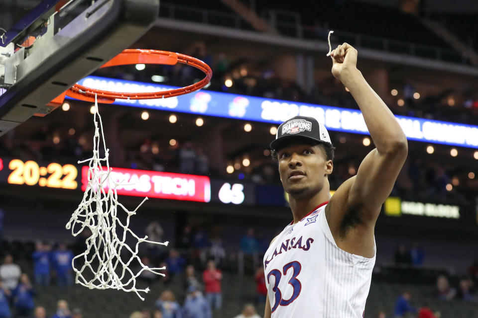 KANSAS CITY, MO - MARCH 12: Kansas Jayhawks forward David McCormack (33) holds up a piece of the nets after the Big 12 Tournament championship game between the Texas Tech Red Raiders and Kansas Jayhawks on Mar 12, 2022 at T-Mobile Arena in Kansas City, MO. (Photo by Scott Winters/Icon Sportswire via Getty Images)