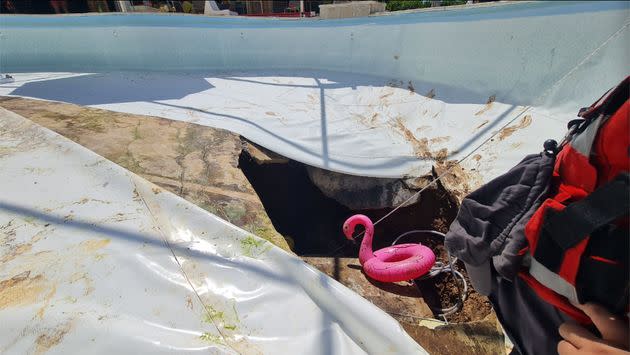 First responders investigate a sinkhole that opened up beneath a pool during an office party in Israel, killing one man and injuring another. (Photo: Israel Fire & Rescue Authority)