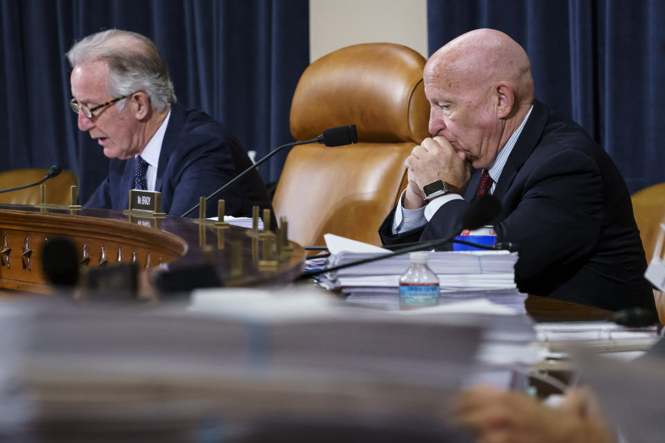 FILE - In this Sept. 14, 2021, file photo House Ways and Means Committee Chairman Richard Neal, D-Mass., left, and Rep. Kevin Brady, R-Texas, the ranking member, right, make opening statements as the tax-writing panel continues work on the Democrats' proposal for tax hikes on big corporations and the wealthy to fund President Joe Biden's $3.5 trillion domestic rebuilding plan, at the Capitol in Washington. (AP Photo/J. Scott Applewhite, File)