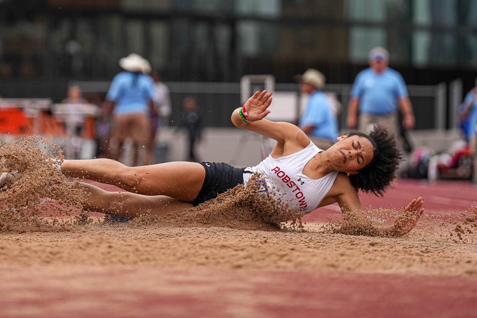 Robstown's Trinity Anscombe lands in the long jump during the Class 4A meet Thursday.