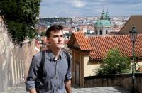 Joseph Petrila walks up the stairs in Prague