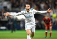 <p>Gareth Bale celebrates his first as Real Madrid take a 2-1 lead</p>