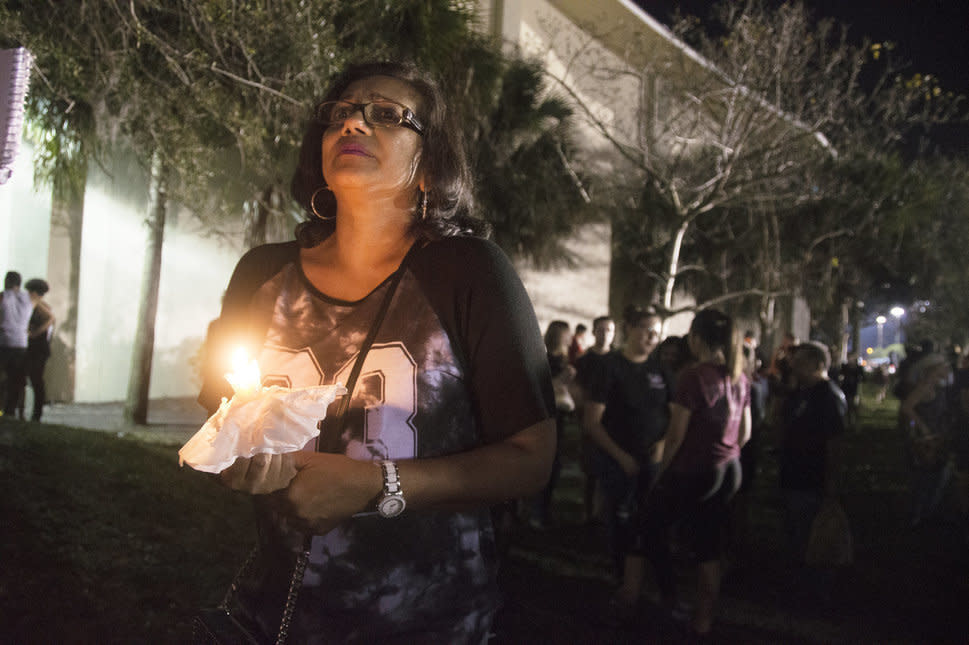 Donna Ali, mother of Marjory Stoneman Douglas High School student Arianna Ali, holds a candle at a vigil mourning those who died. (Photo: Johanne Rahaman for HuffPost)