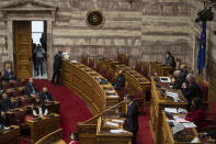 Greek Prime Minister Kyriakos Mitsotakis speaks during a parliamentary session in Athens, Thursday, Feb. 25, 2021. Mitsotakis has promised to outline proposed legal changes in parliament on Thursday to make it easier for victims of sexual assault to report the crimes. (AP Photo/Petros Giannakouris)