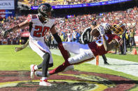 <p>Washington Redskins wide receiver Josh Doctson (18) pulls in a touchdown pass as Atlanta Falcons free safety Isaiah Oliver (20) looks one during the first half of an NFL football game between the Atlanta Falcons and the Washington Redskins, Sunday, Nov. 4, 2018 in Landover, Md. (AP Photo/Susan Walsh) </p>