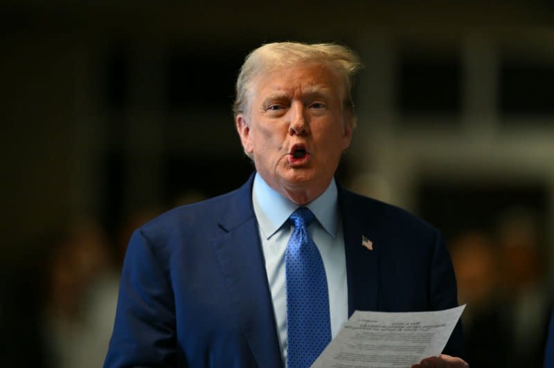 Former President Donald Trump speaks to reporters as he arrives for his trial at Manhattan criminal court in New York on Thursday. Trump's criminal trial is entering its fourth week on charges he allegedly falsified business records to cover up a sex scandal during the 2016 presidential campaign. Pool photo by Angela Weiss/UPI