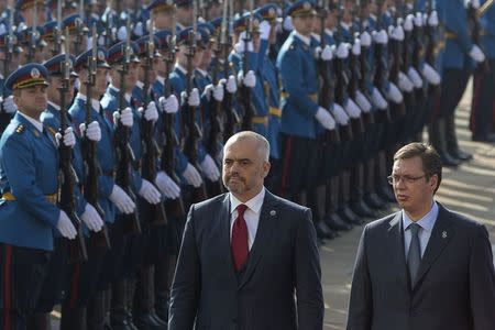 Albanian Prime Minister Edi Rama (L) and his Serbian counterpart Aleksandar Vucic inspect the honour guard during an official welcoming ceremony in Belgrade November 10, 2014. REUTERS/Marko Djurica