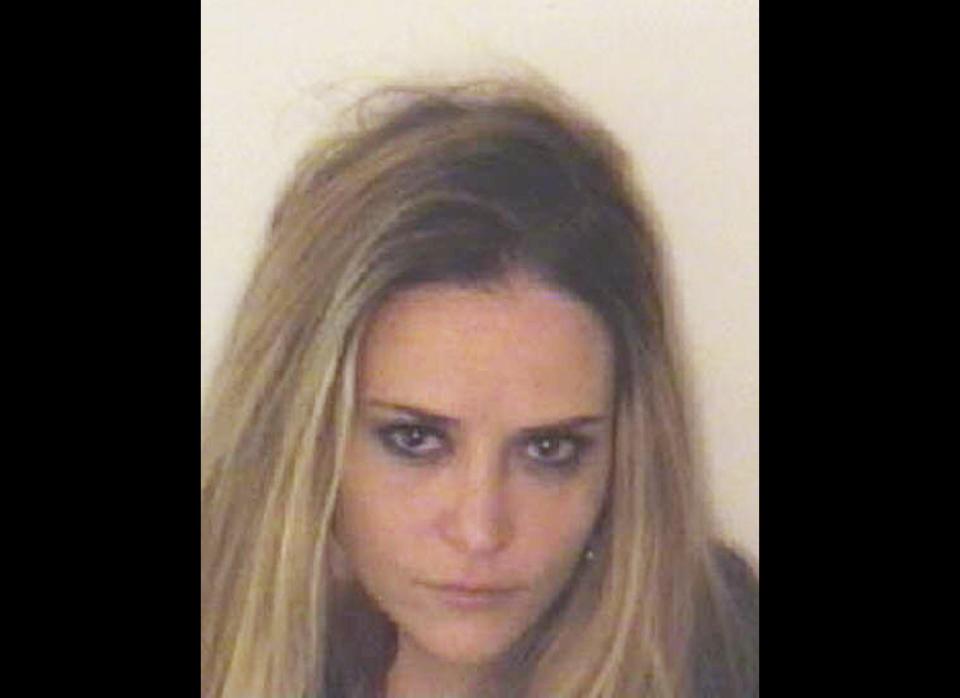 In this handout photograph supplied by the Aspen Police Department, 34-year-old Brooke Mueller poses for her mugshot after being arrested and charged with assualt and possession of cocaine with intent to distribute on December 3, 2011 in Aspen, Colorado. The ex-wife of American actor Charlie Sheen was arrested in the early hours of December 3, 2011 after a woman reported an assualt identifying Mueller as the assailant.  (Getty)