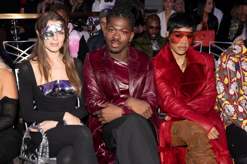 Julia Fox, from left, Lil Nas X and Teyana Taylor attend the LaQuan Smith Fall/Winter 2023 fashion show at the Rainbow Room on Monday, Feb. 13, 2023, in New York.