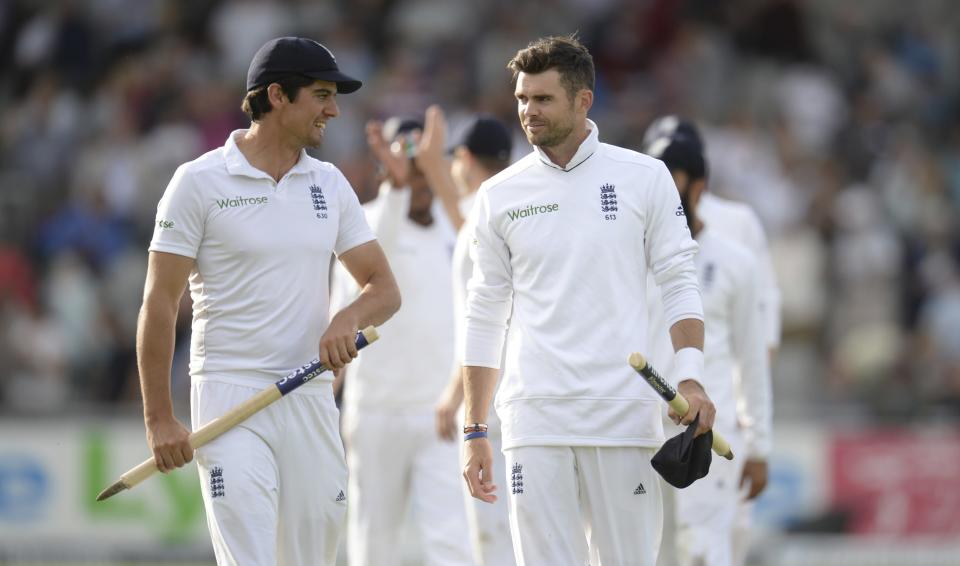 England's captain Alastair Cook (L) and James Anderson leave the field after England won the fourth cricket test match against India at Old Trafford cricket ground in Manchester, England August 9, 2014. REUTERS/Philip Brown (BRITAIN - Tags: SPORT CRICKET)