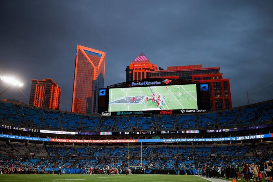 The setting sun illuminates the skyline during a game between the Carolina Panthers and the Arizona Cardinals at Bank of America Stadium in Charlotte October 2, 2022.