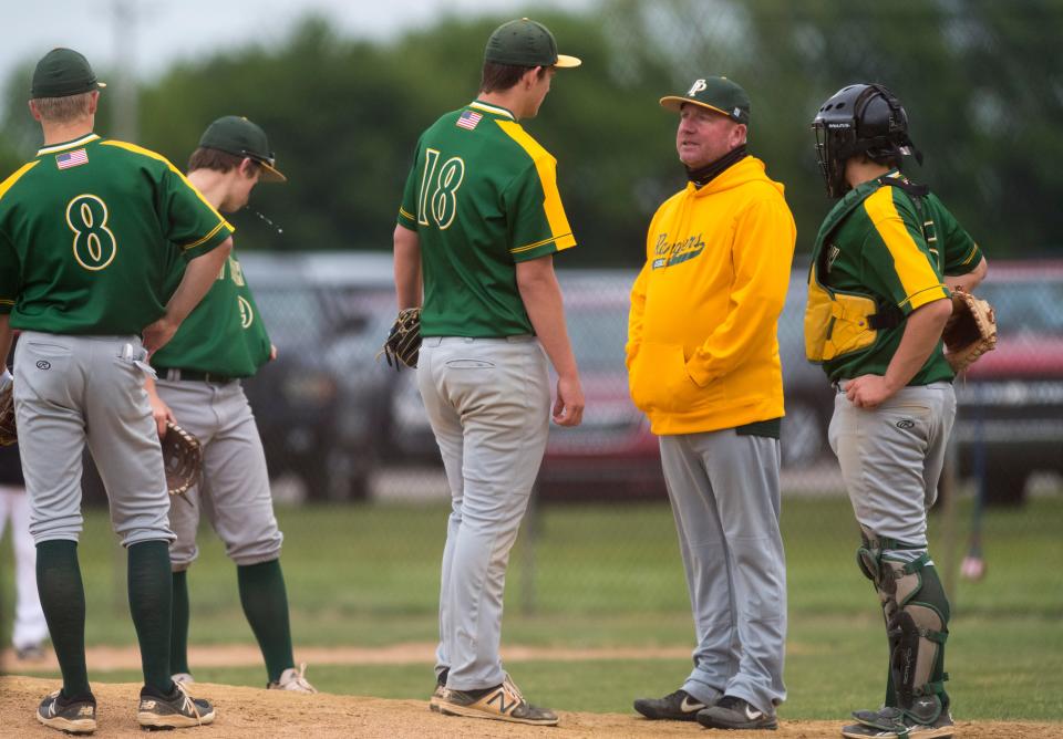Forest Park Head Coach Jarred Howard gathers the infield at the mound as the Forest Park Rangers take on the North Posey Vikings Tuesday evening, May 11, 2021. 