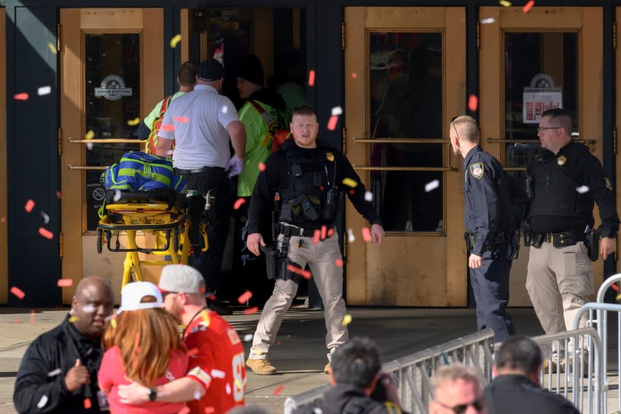Emergency personnel, left, take a stretcher into Union Station following a shooting at the Kansas City Chiefs NFL football Super Bowl celebration in Kansas City, Mo., Wednesday, Feb. 14, 2024. Multiple people were injured, a fire official said.(AP Photo/Reed Hoffmann)