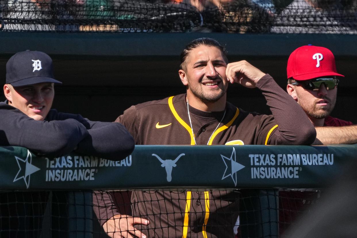Former Texas catcher Michael Cantu, now with the San Diego Padres' Triple-A affiliate in El Paso, watches Saturday's UT alumni game from the dugout at UFCU Disch-Falk Field. “(He’s) a guy that just keeps grinding and stuck with it,” UT coach David Pierce said. “Who knows? He may play in the big leagues for a long time.”