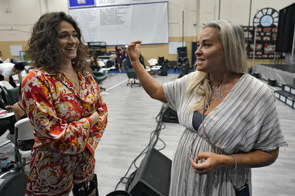 Director Cynthia Nekvasil, right, and musical director Camille Trust chat during a rehearsal for the touring show "Hits! The Musical" Wednesday, Feb. 8, 2023, in Clearwater, Fla. Singer Dionne Warwick and her son Damon Elliott are co-producing the 50-city touring show. (AP Photo/Chris O'Meara)