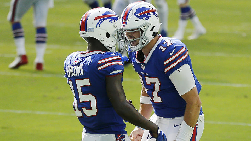 MIAMI GARDENS, FLORIDA - SEPTEMBER 20: Josh Allen #17 of the Buffalo Bills celebrates with John Brown #15 after a 46-yard touchdown during the fourth quarter at Hard Rock Stadium on September 20, 2020 in Miami Gardens, Florida. (Photo by Michael Reaves/Getty Images)