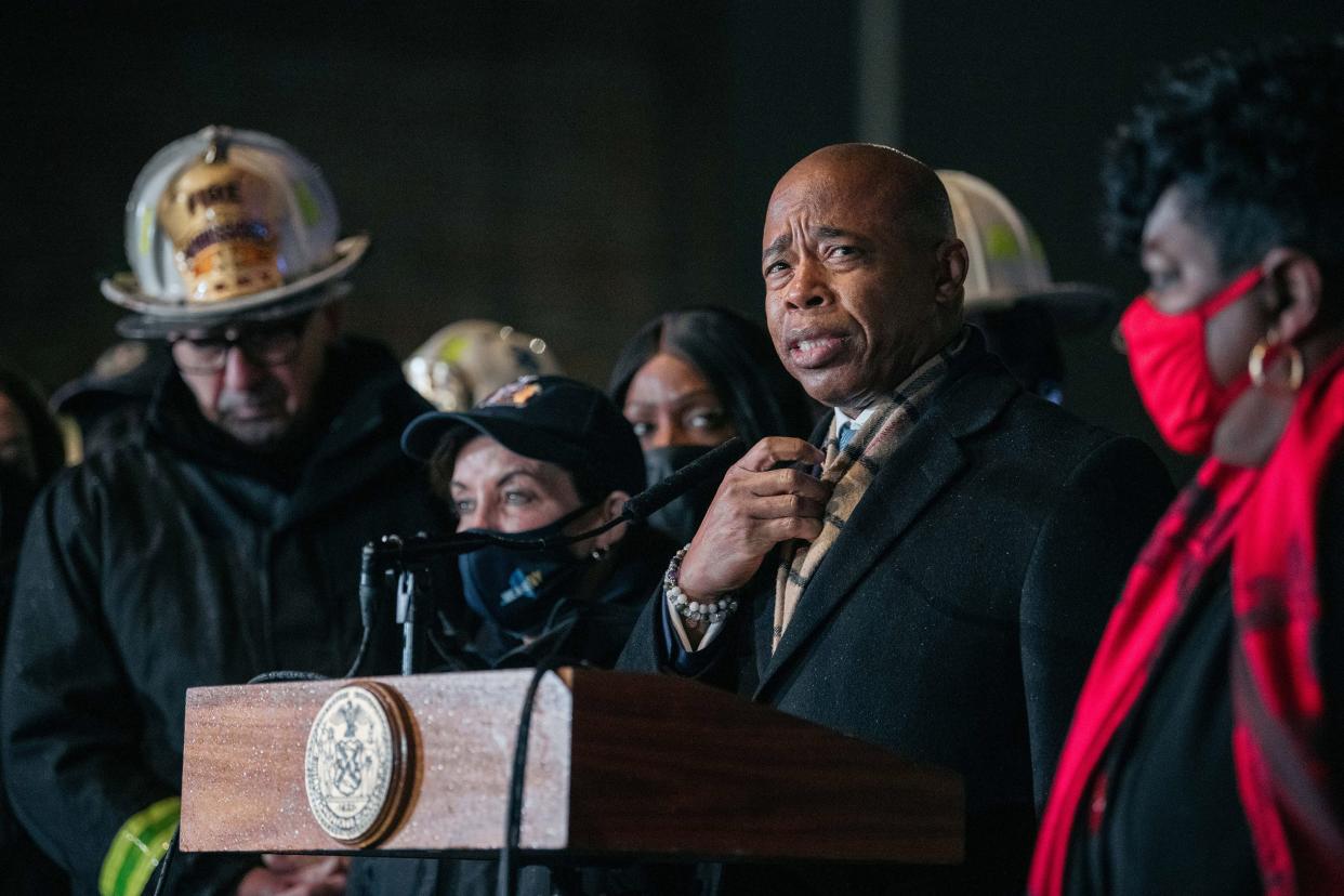 New York City Mayor Eric Adams addresses the media in the aftermath of a deadly fire at a 19-story building on Jan. 9, 2022, in the Bronx borough of New York City. At least 19 people, including nine children, died in the blaze, according to officials.