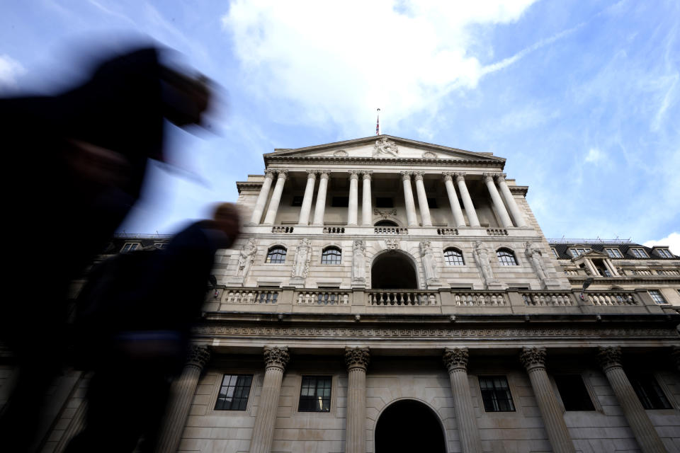 Pedestrians walk past The Bank of England in London, Thursday, Sept. 22, 2022. Britain's central bank is under pressure to make another big interest rate hike Thursday. Inflation in the United Kingdom is outpacing other major economies, but the U.S. Federal Reserve and other banks are moving faster to get prices under control. (AP Photo/Kirsty Wigglesworth)