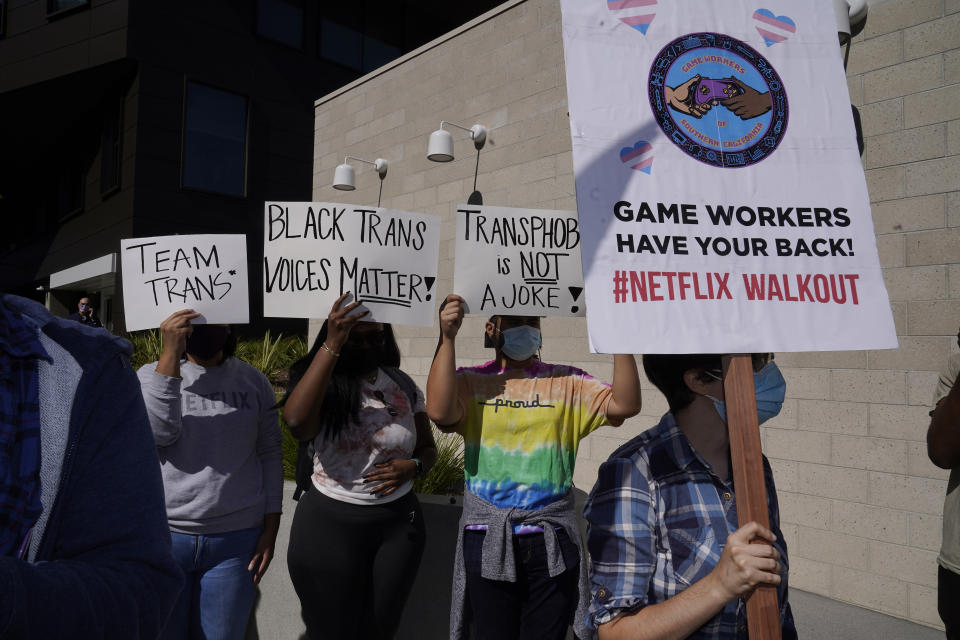 People protest outside the Netflix building in the Hollywood section of Los Angeles, Wednesday, Oct. 20, 2021. Critics and supporters of Dave Chappelle's Netflix special and its anti-transgender comments gathered outside the company's offices Wednesday. (AP Photo/Damian Dovarganes)