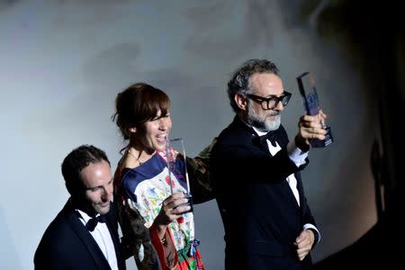 Massimo Bottura, the chef patron of Osteria Francescana restaurant in Italy, next to his wife Lara Gilmore, receives the award for Best Restaurant during the World's 50 Best Restaurants Awards at the Palacio Euskalduna in Bilbao, Spain, June 19, 2018. REUTERS/Vincent West