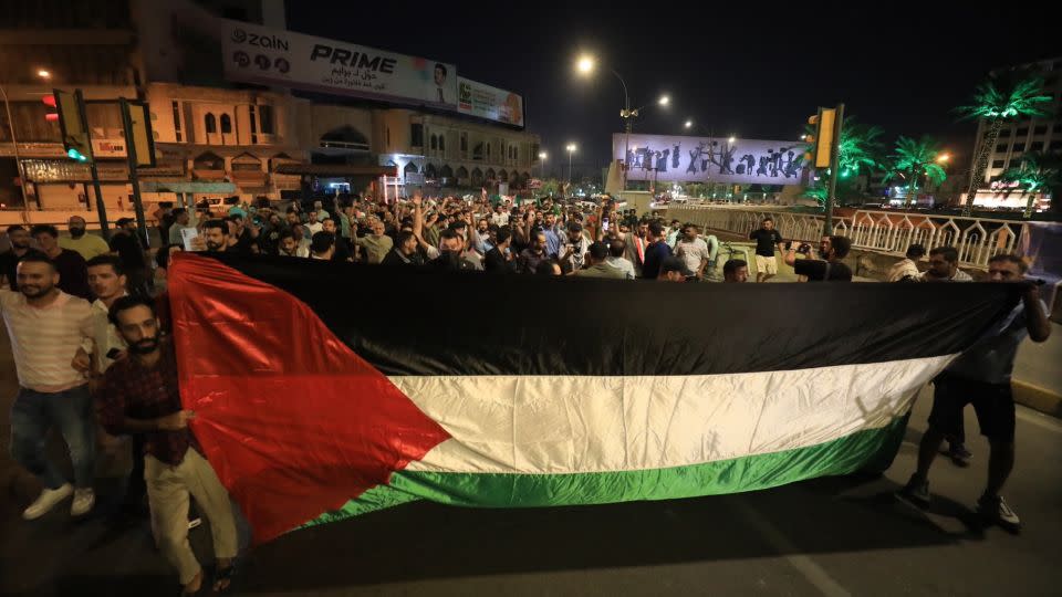 People gather in Tahrir Square to protest the Gaza hospital blast in Baghdad, Iraq, on October 17. - Murtadha Al-Sudani/Anadolu Agency/Getty Images